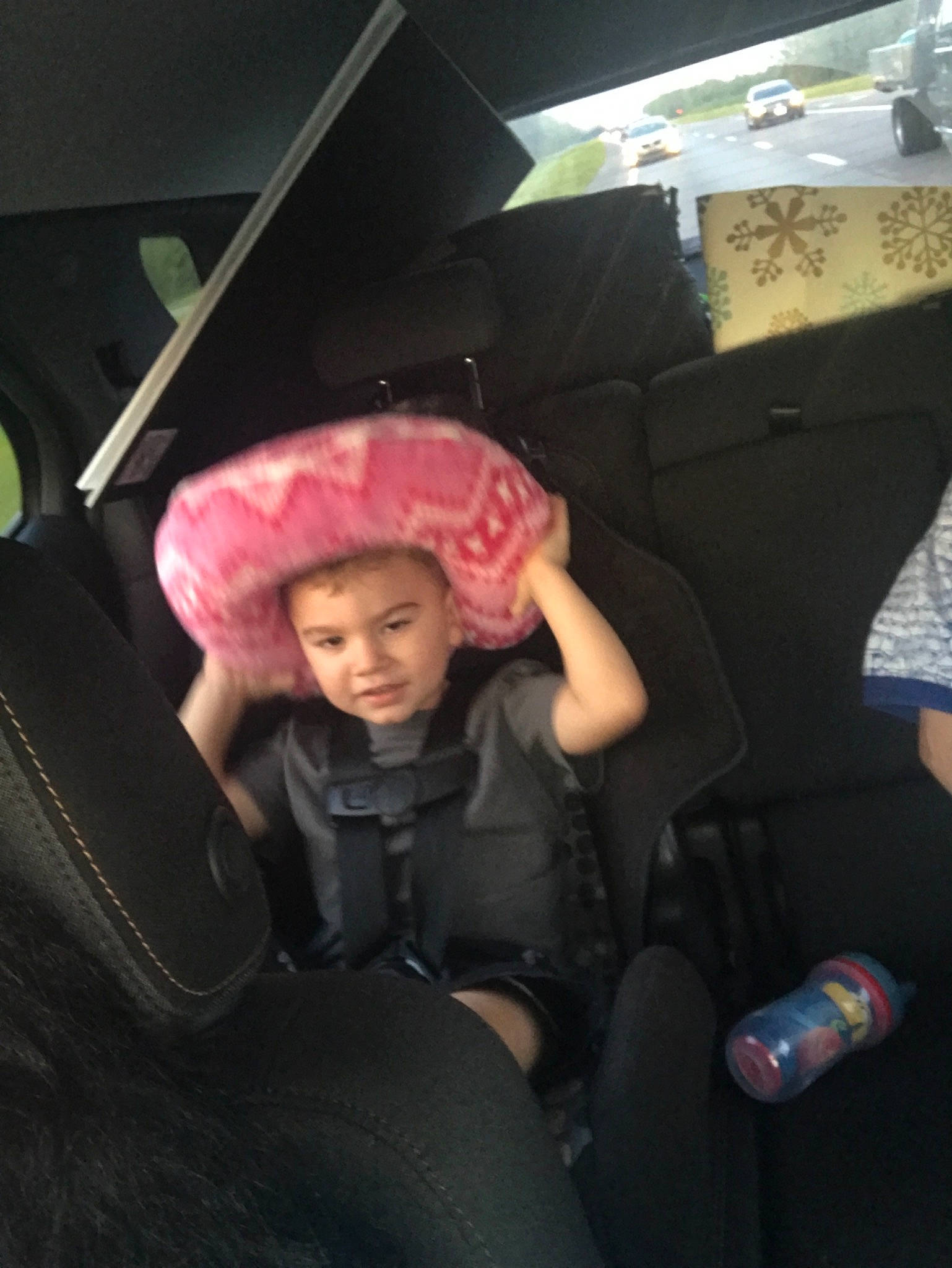Adien is registered to the contest to win money with this photo: car, car_seat, child, cool, fun, girl, headgear, person, pink, product, textile