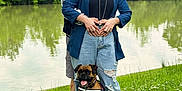 Ostyn participe au concours pour gagner de l'argent avec cette photo : canine, casual_clothing, couple, dog, embrace, grass, greenery, happy, lake, leisure, nature, outdoor, pet, portrait, relaxation, scenic, smiling, summer, sunlight, trees