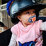 baby, helmet, pacifier, pink_vest, knitted_clothing, shark_design, hand, stroller, wooden_background, child, cute, infant, clothing, sitting, portrait, face, eyes, indoor, person, pacifier_clip