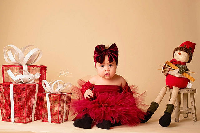 Galilea joined the competition — help win amazing prizes! carmine, child, costume, costume_hat, doll, event, fashion_design, fictional_character, fur, happy, hat, holiday, magenta, peach, person, pink, red, room, sitting, toddler