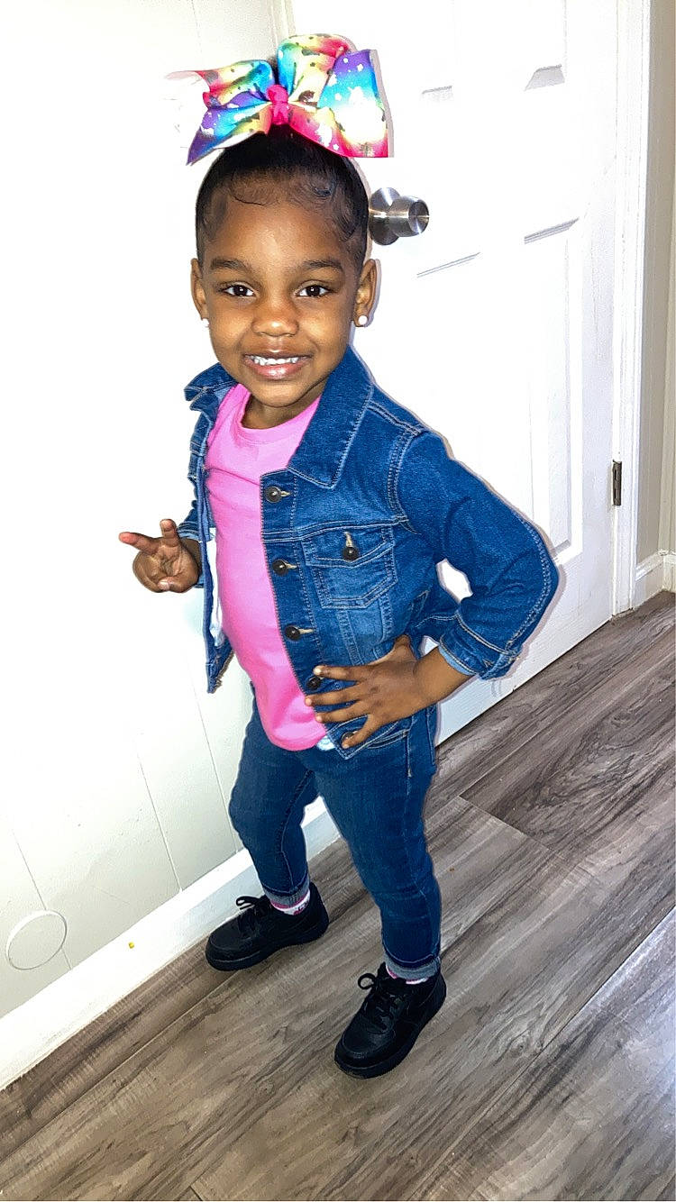 Aminah is registered to the contest to win money with this photo: baby_toddler_clothing, beauty, clothing, eye, face, facial_expression, gesture, hair, happy, head, joy, person, pink, purple, shoulder, skin, sleeve, smile, standing, toddler