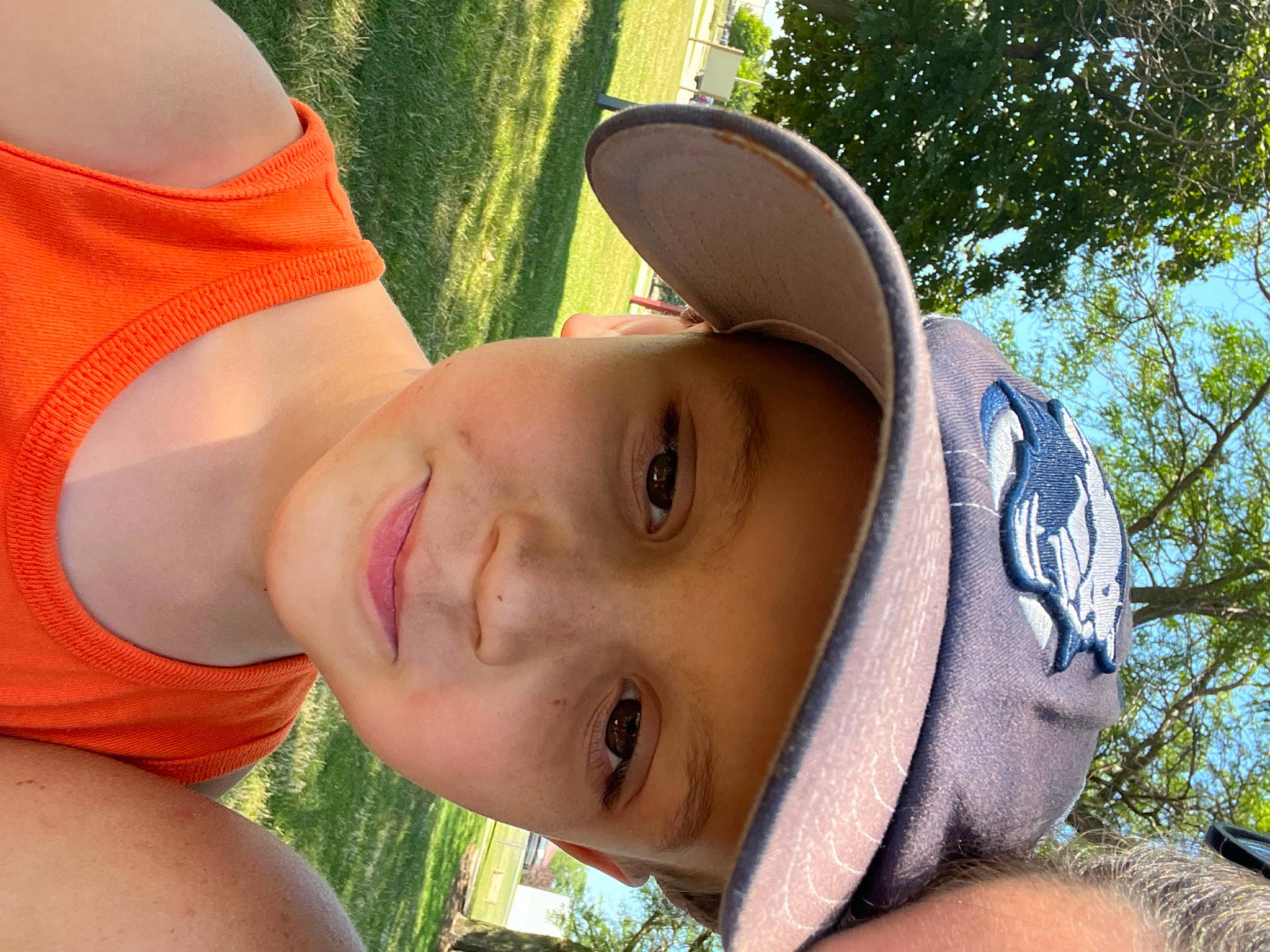 Miles joined the competition — help win amazing prizes! cap, chest, eyewear, fun, grass, happy, hat, headwear, landscape, leisure, people_in_nature, person, plant, recreation, smile, summer, sun_hat, sunglasses, toddler, tree