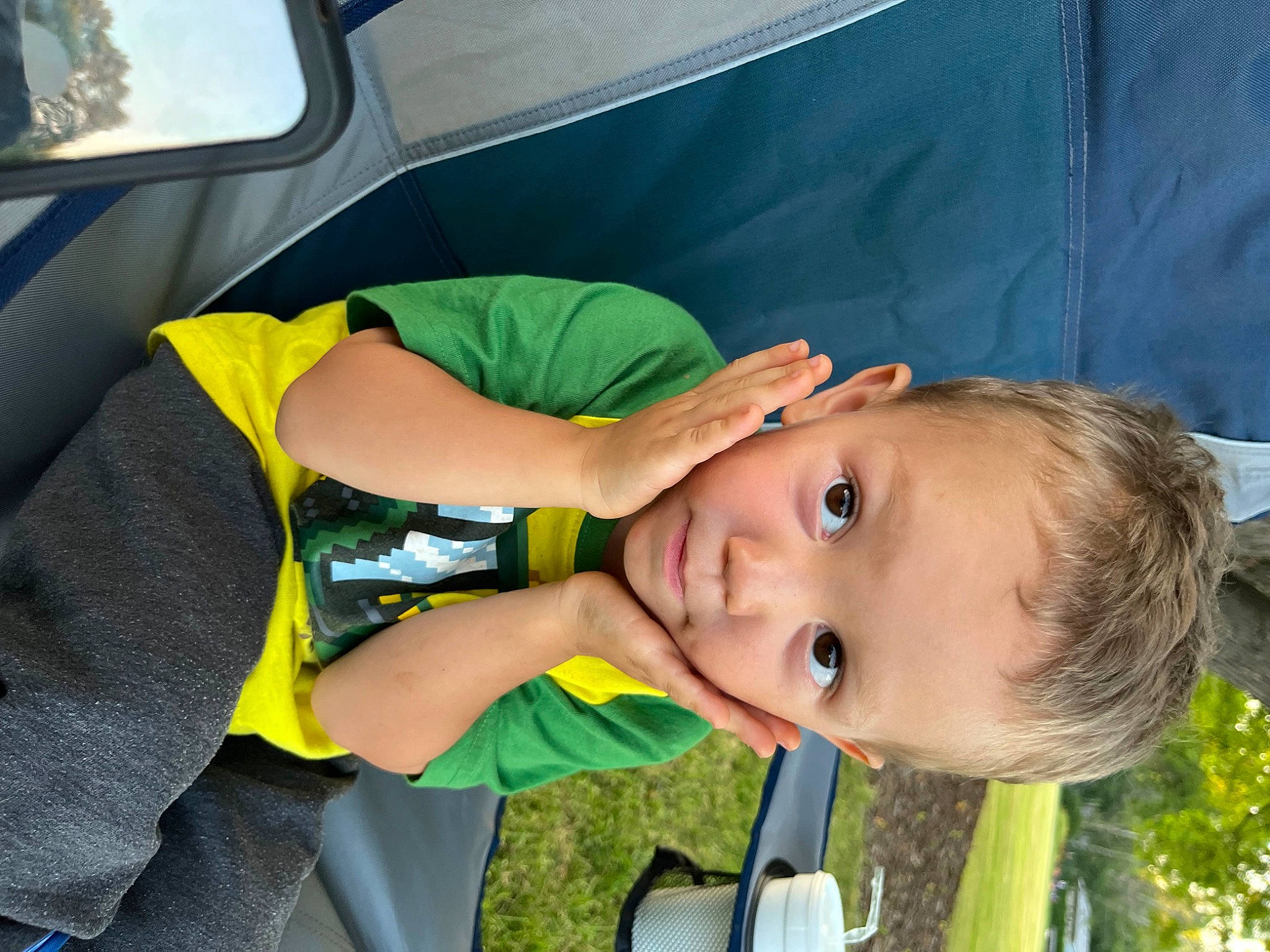 Landen is registered to the contest to win money with this photo: auto_part, baby, baby_products, child, family_car, fun, grass, happy, leisure, nose, person, play, recreation, toddler, tree, vacation, vehicle_door, yellow