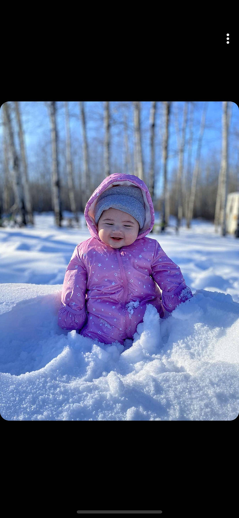 Collins is registered to the contest to win money with this photo: baby, child, freezing, fun, headwear, leisure, outerwear, person, photography, pink, play, playing_in_the_snow, purple, recreation, sky, smile, snow, toddler, winter