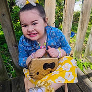 Dayanis is registered to the contest to win money with this photo: bow, bracelets, child, denim_jacket, fashion, floral_pattern, girl, greenery, happy, hello_kitty, necklace, outdoor, portrait, purse, silver_shoes, smile, sunlight, white_socks, wooden_deck, yellow_skirt