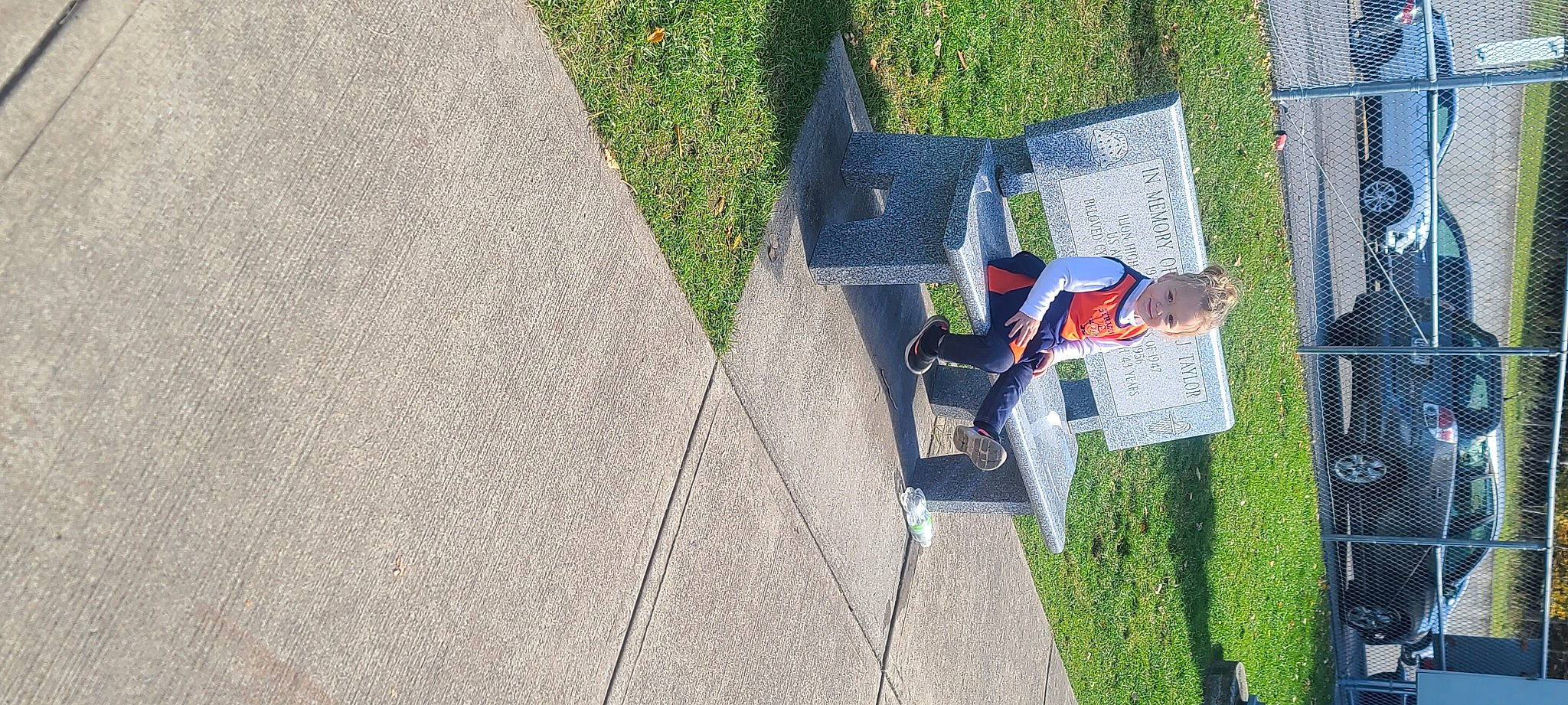 Gianna is registered to the contest to win money with this photo: asphalt, composite_material, concrete, curb, flooring, grass, joy, leisure, pattern, person, plant, recreation, road_surface, shadow, sidewalk, tar, tree, urban_design, walking_shoe