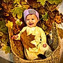baby, child, autumn, leaves, basket, smiling, hat, yellow_onesie, indoor, cozy, cute, seasonal, playful, portrait, happy, fall, nature, leaf, woven_basket, infant