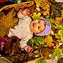 Aurora joined the competition — help win amazing prizes! baby, child, basket, autumn_leaves, fall, purple_beanie, white_shirt, pink_pants, indoor, cozy, cute, smiling, face, hands, nature, seasonal, leaf, warm_colors, portrait, lying_down