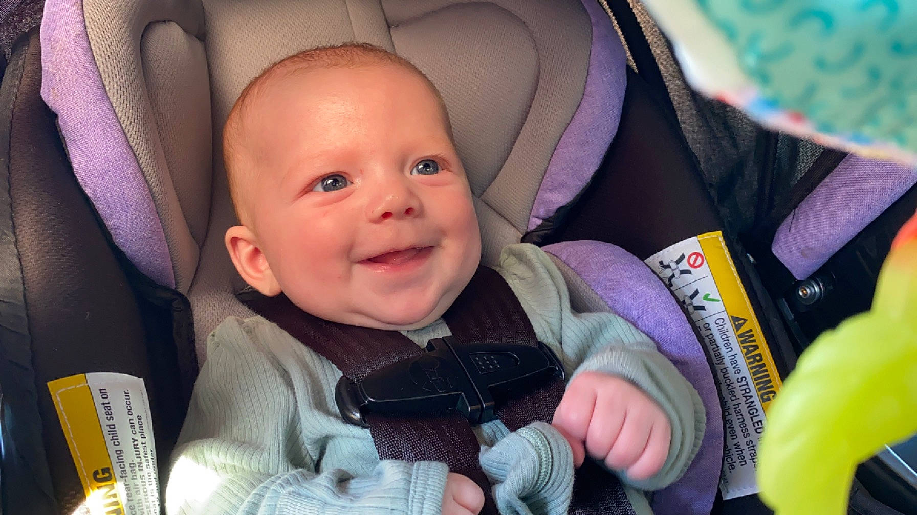 Althea is registered to the contest to win money with this photo: auto_part, baby, baby_carriage, baby_in_car_seat, baby_products, baby_toddler_clothing, car_seat, cheek, child, comfort, eye, finger, fun, happy, iris, joy, person, product, purple, skin