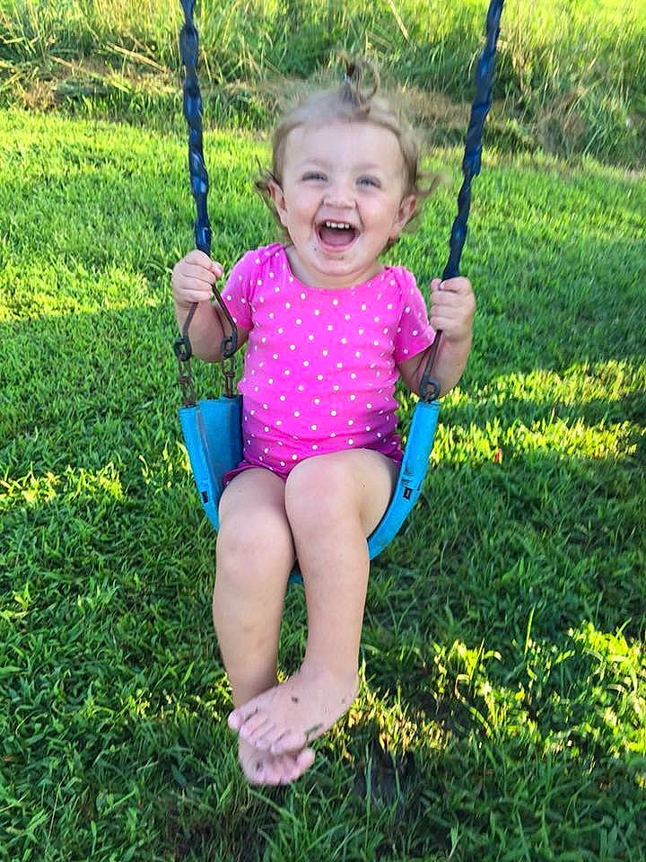 Kinleigh is registered to the contest to win money with this photo: baby, child, fun, grass, happy, joy, outdoor_play_equipment, person, photography, plant, play, playground, smile, summer, swing, toddler, tree, vacation