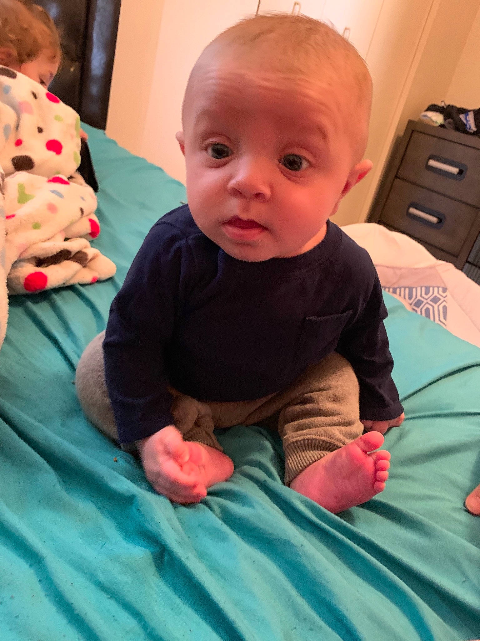 Austin joined the competition — help win amazing prizes! baby, cheek, child, eye, face, finger, head, iris, mouth, person, sitting, skin, smile, surprise, toddler, tummy_time