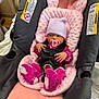 baby, car_seat, pacifier, hat, pink, purple, blanket, infant, child, clothing, sitting, safety_harness, indoors, cute, newborn, person, soft, warm, baby_accessory, resting