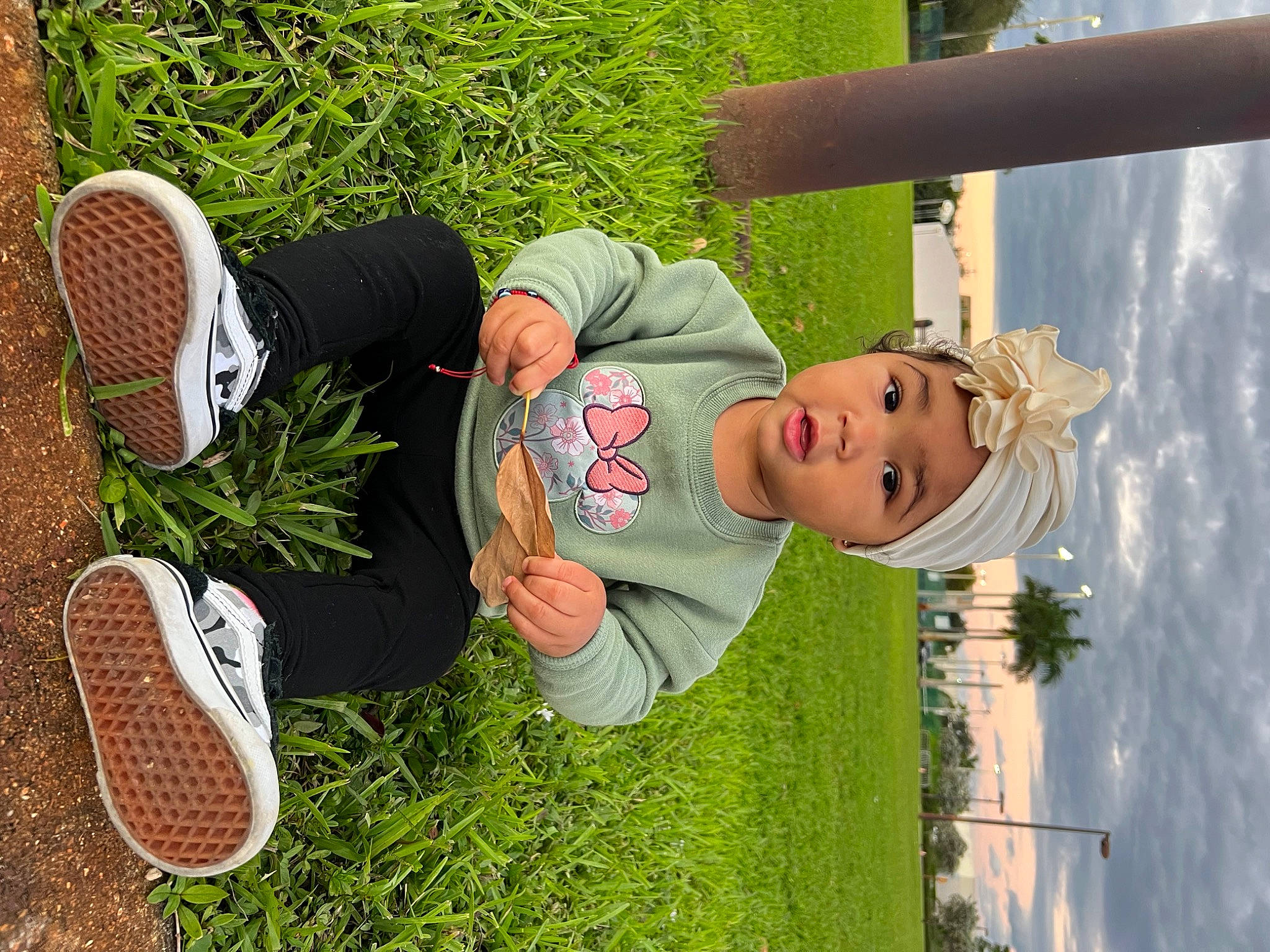 Leilana is registered to the contest to win money with this photo: child, fun, grass, green, happy, hat, headwear, lawn, leisure, outdoor_shoe, people_in_nature, person, plant, recreation, smile, spring, sun_hat, t_shirt, toddler, tree