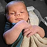 Zaylen is registered to the contest to win money with this photo: baby, infant, towel, hand, face, skin, sleepy, cozy, soft, blanket, newborn, child, portrait, closeup, cute, relaxed, indoor, light, person, calm