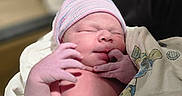 Zaylen is registered to the contest to win money with this photo: newborn, baby, infant, blanket, beanie, sleeping, hand, skin, person, portrait, cute, soft_light, indoors, wrapped, newborn_hat, peaceful, tiny_fingers, closeup, fresh_born, human