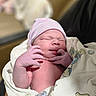 newborn, baby, infant, blanket, beanie, sleeping, hand, skin, person, portrait, cute, soft_light, indoors, wrapped, newborn_hat, peaceful, tiny_fingers, closeup, fresh_born, human