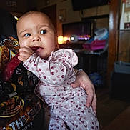 Azavia joined the competition — help win amazing prizes! adult, baby, casual, child, cozy, cute, dim_lighting, furniture, graphic_tee, hand, heart_pattern, holding, indoor, living_room, pajamas, person, portrait, snack, table, television