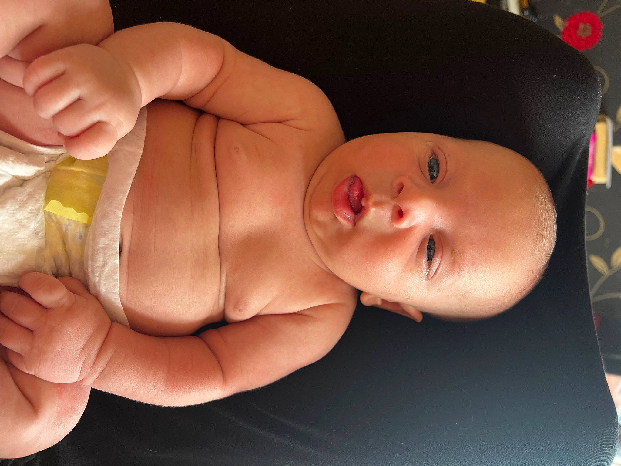 Harrison is registered to the contest to win money with this photo: abdomen, baby, cheek, chest, child, eyelash, finger, gesture, hand, head, human_body, lip, mouth, nail, nose, person, skin, stomach, thumb, toddler