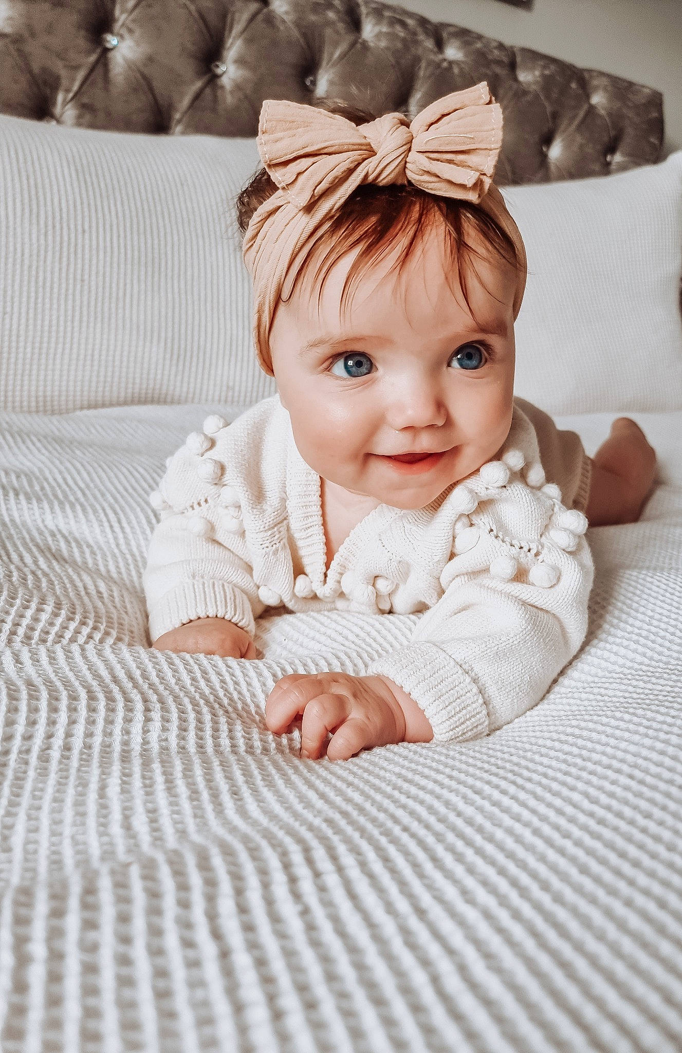 Martha is registered to the contest to win money with this photo: baby, baby_toddler_clothing, cheek, chin, comfort, eye, flash_photography, floor, flooring, grass, happy, head, iris, joy, linens, outerwear, person, skin, sleeve, smile