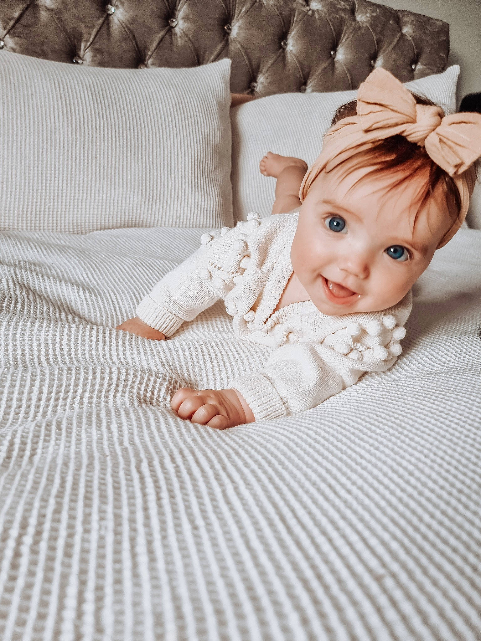 Martha is registered to the contest to win money with this photo: baby, baby_toddler_clothing, bedding, child, comfort, eyelash, fashion_accessory, flash_photography, floor, flooring, happy, headpiece, linens, pattern, person, skin, sleeve, smile, textile, toddler