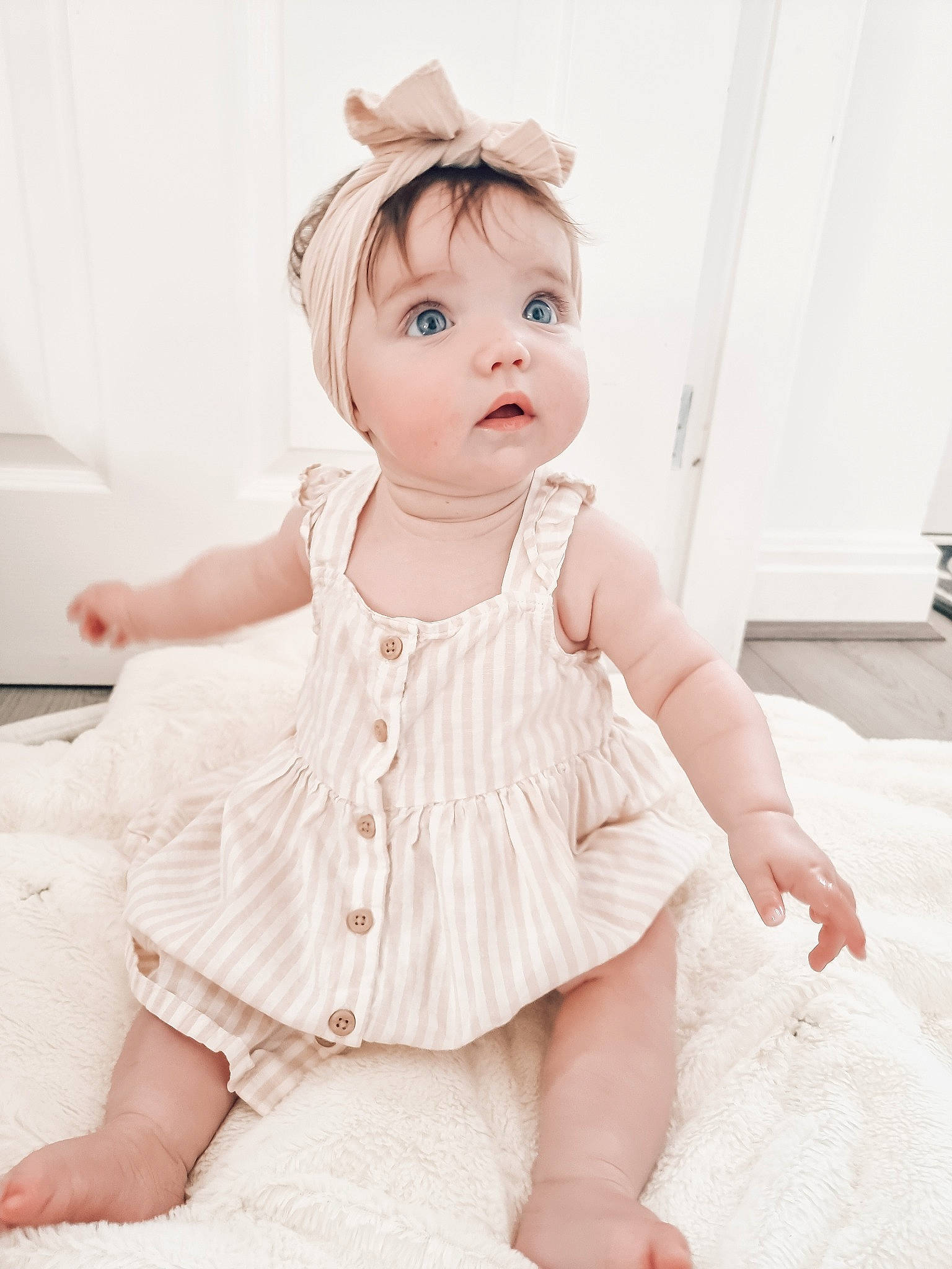Martha is registered to the contest to win money with this photo: baby, baby_toddler_clothing, collar, day_dress, dress, dress_shirt, embellishment, finger, flash_photography, headgear, lip, neck, one_piece_garment, outerwear, pattern, person, pink, shoulder, skin, sleeve