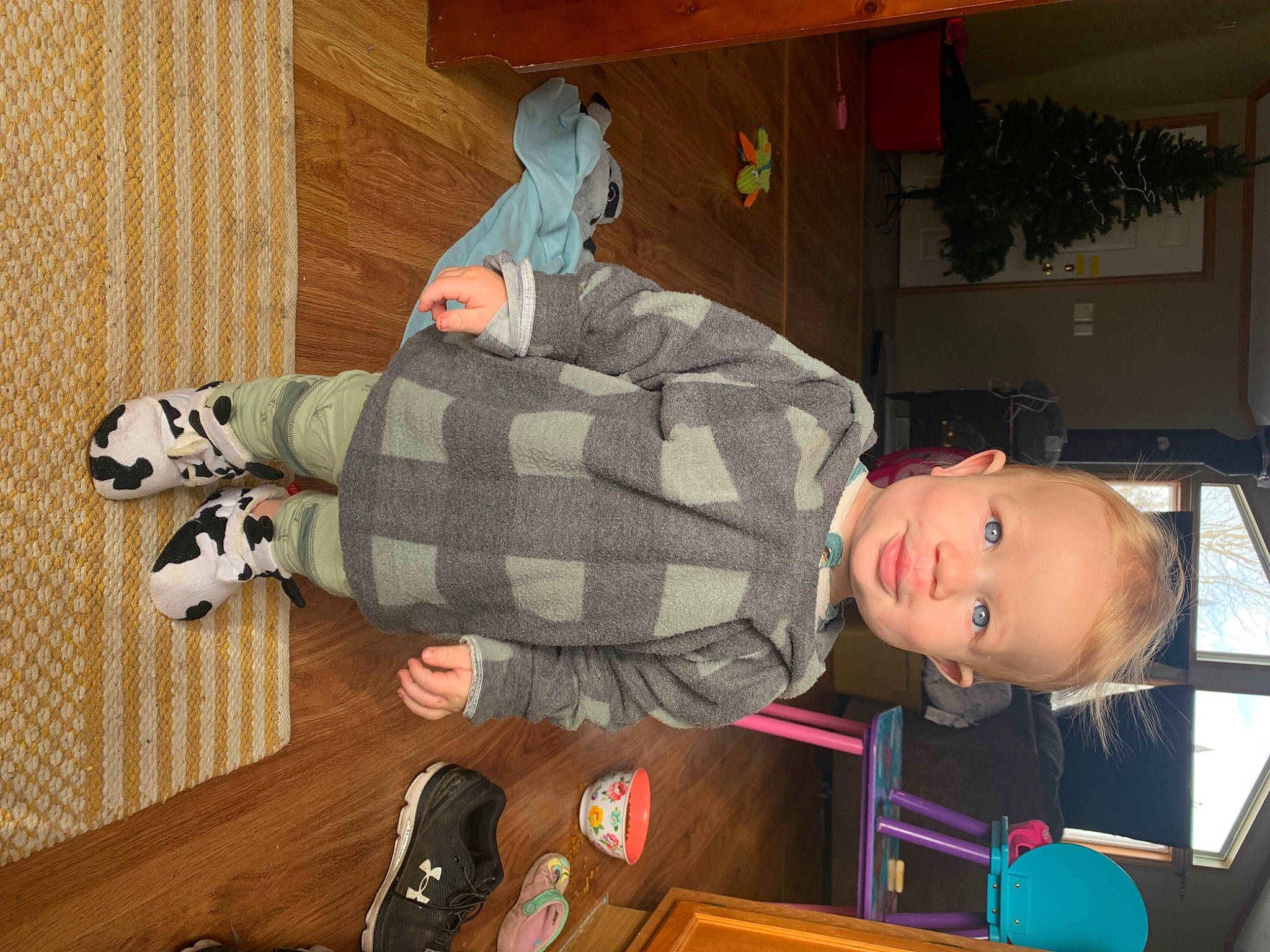 Daxton is registered to the contest to win money with this photo: child, comfort, flooring, fun, fur, hardwood, human_leg, luggage_and_bags, pattern, person, plaid, room, sitting, stuffed_toy, tartan, toddler, toy, wood