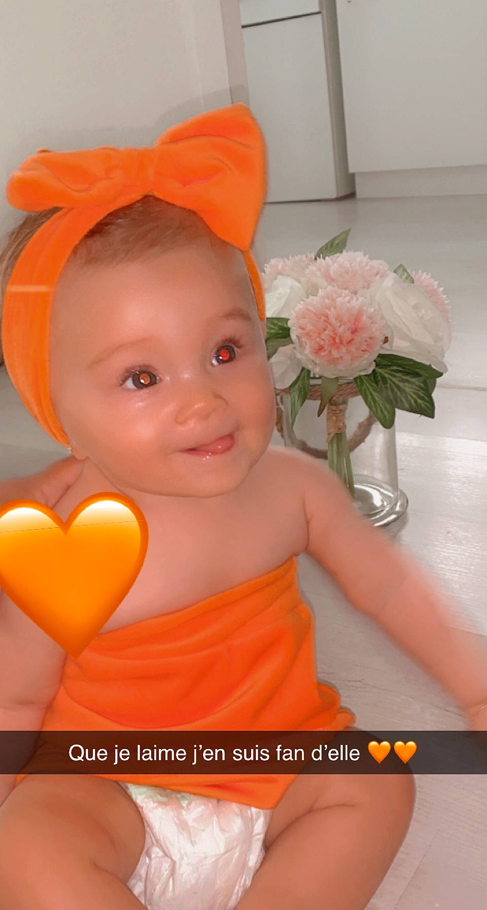 Sinaï participe au concours pour gagner de l'argent avec cette photo : baby, baby_toddler_clothing, beauty, cap, costume_hat, dress, flower, flower_arranging, happy, headpiece, joy, lip, orange, peach, person, petal, pink, product, rose, skin