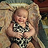 October is registered to the contest to win money with this photo: baby, infant, smile, cute, cow_print, blanket, fabric, clothing, person, indoor, furniture, shoe, happy, skin, arm, legs, head, face, home, cozy