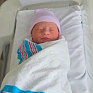 Bodie joined the competition — help win amazing prizes! newborn, baby, swaddled, hospital, blanket, cap, sleeping, infant, bed, white, striped, resting, cute, child, portrait, healthcare, soft, peaceful, wrapped, person