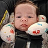 Landon joined the competition — help win amazing prizes! baby, infant, car_seat, neck_pillow, straps, face, hair, expressionless, clothing, patterned_pillow, seatbelt, closeup, indoor, child, cute, safety, portrait, toddler, resting, head_support