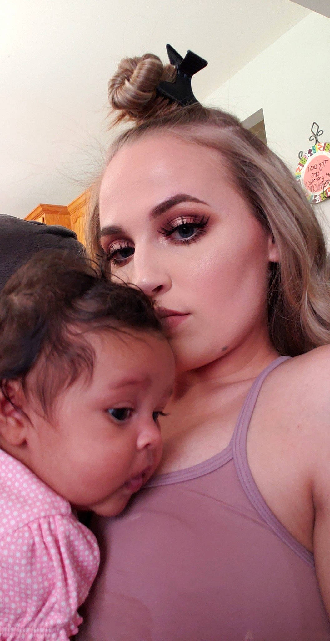 Erykah is registered to the contest to win money with this photo: baby, cheek, child, daughter, ear, face, forehead, gesture, interaction, mother, mouth, neck, nose, person, throat, toddler