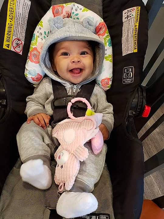 Erykah joined the competition — help win amazing prizes! baby, baby_in_car_seat, baby_products, car_seat, child, headwear, person, product, smile, toddler