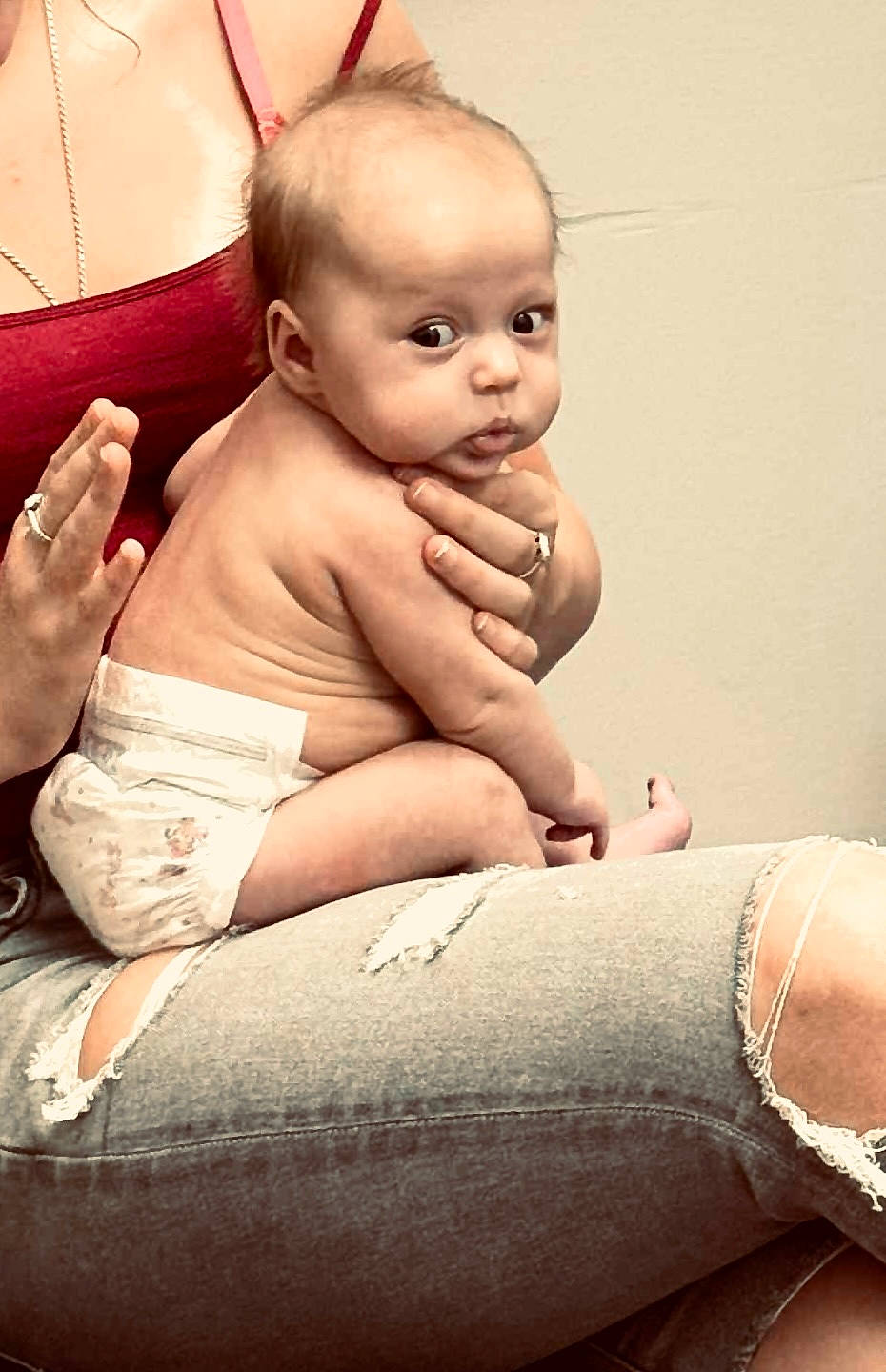 Keygan Alminta joined the competition — help win amazing prizes! baby, casual, curious, cute, diaper, expression, face, hand, holding, human, indoor, infant, jeans, person, portrait, red_top, ripped_jeans, sitting, skin, young_child