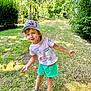 child, boy, outdoor, grass, trees, nature, cap, shorts, tshirt, shoes, smiling, playful, sunny, daylight, path, greenery, happy, person, portrait, summer