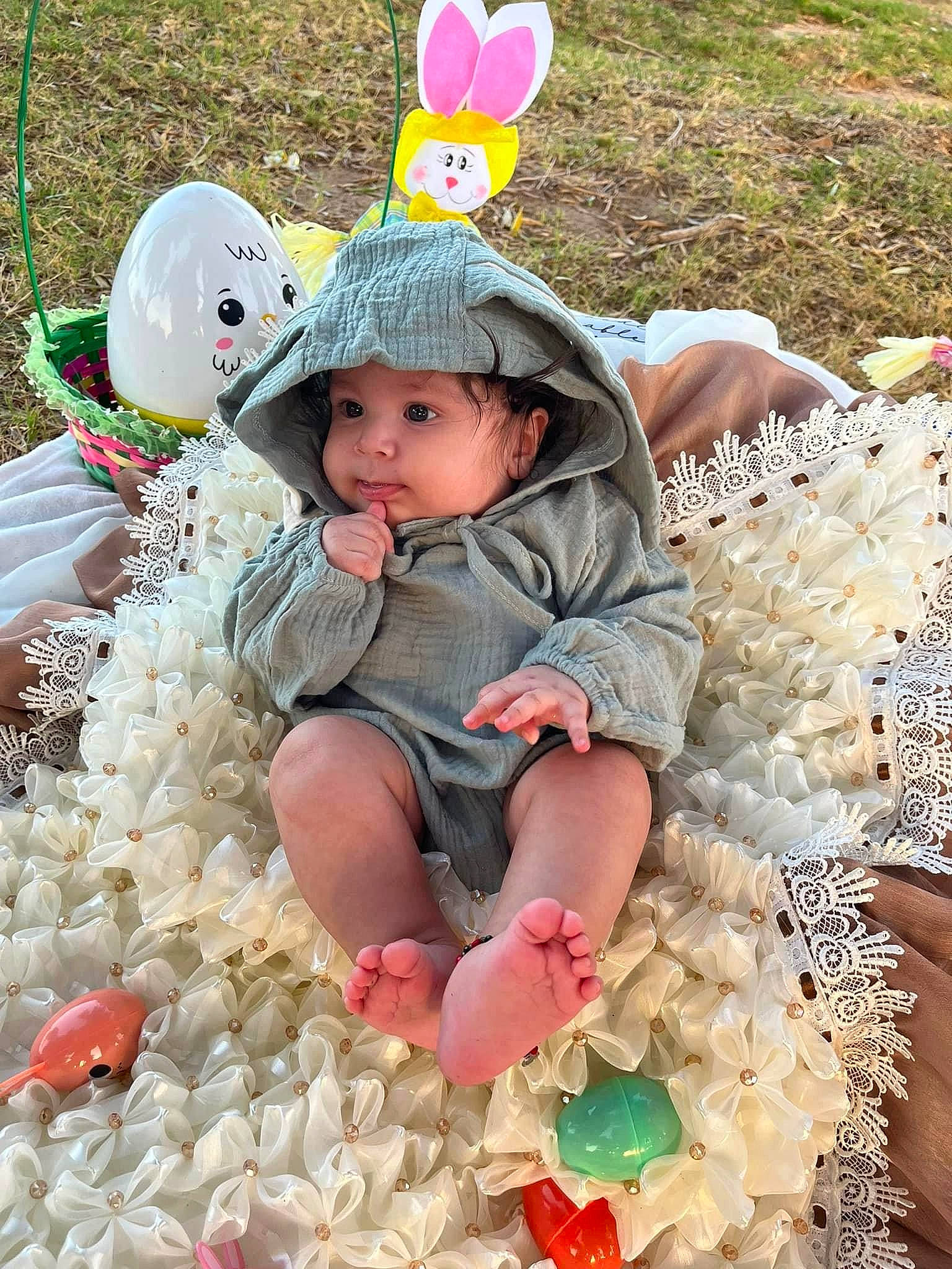 Adriel is registered to the contest to win money with this photo: baby_toddler_clothing, baseball_cap, cap, child, event, fun, grass, green, happy, headwear, leisure, mammal, peach, people_in_nature, person, pink, sitting, spring, textile, toddler
