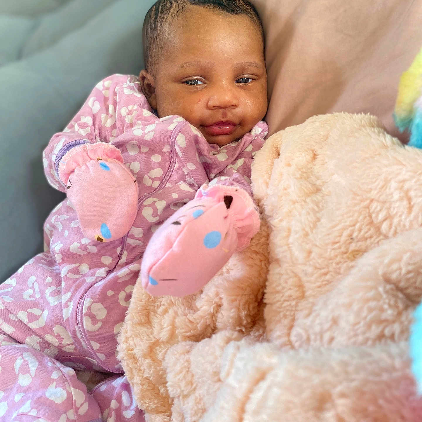 Unity is registered to the contest to win money with this photo: baby, babylaughing, blanket, clothing, cushion, face, happy, head, homedecor, newborn, pajamas, person, photography, portrait, quilt, smile, teddybear, toy, yawning