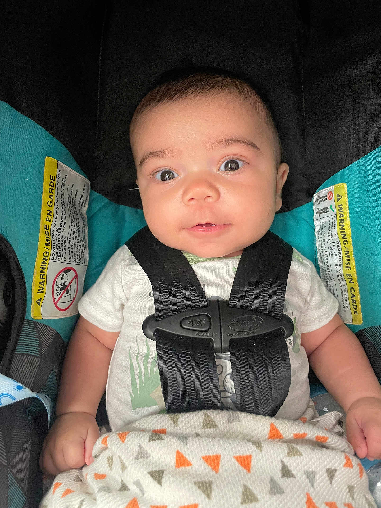 Bryson joined the competition — help win amazing prizes! baby, car_seat, blanket, straps, warning_label, clothing, infant, face, eyes, hands, seatbelt, pattern, fabric, cute, portrait, child, sitting, closeup, indoor, safety