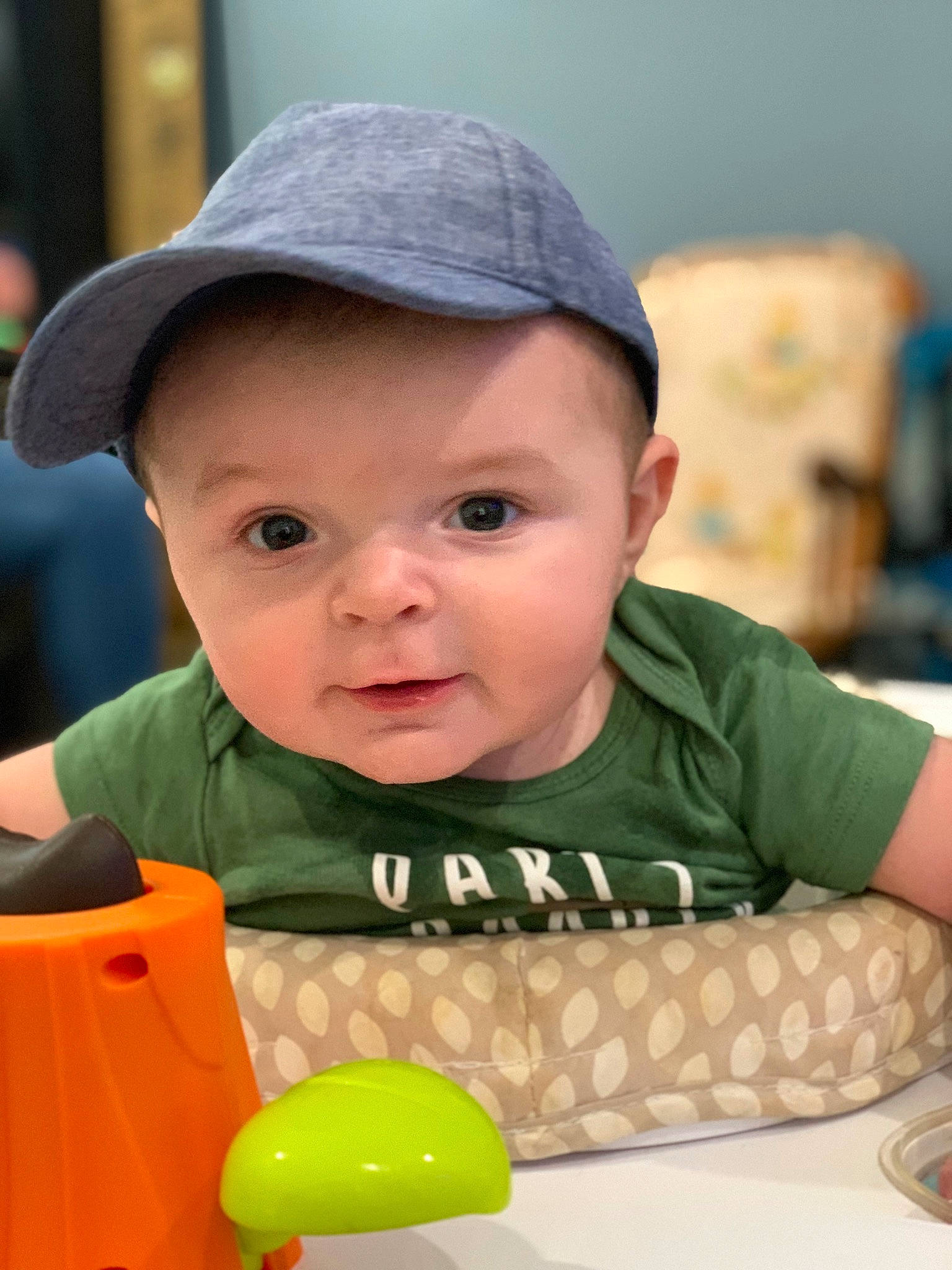 Dayton joined the competition — help win amazing prizes! baby, baby_playing_with_toys, baby_toddler_clothing, baseball_cap, cap, cheek, child, facial_expression, fun, hairstyle, happy, hat, headwear, leisure, person, recreation, sitting, skin, snapshot, t_shirt