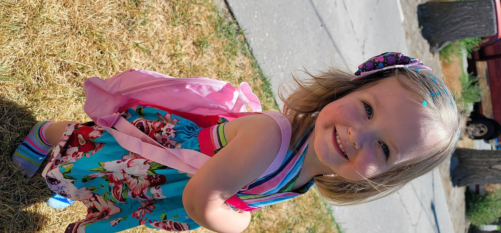 Ashlyn is registered to the contest to win money with this photo: child, eyewear, fashion_accessory, fun, grass, happy, human_leg, joy, leisure, magenta, people_in_nature, person, pink, plant, play, portrait_photography, recreation, smile, summer, thigh