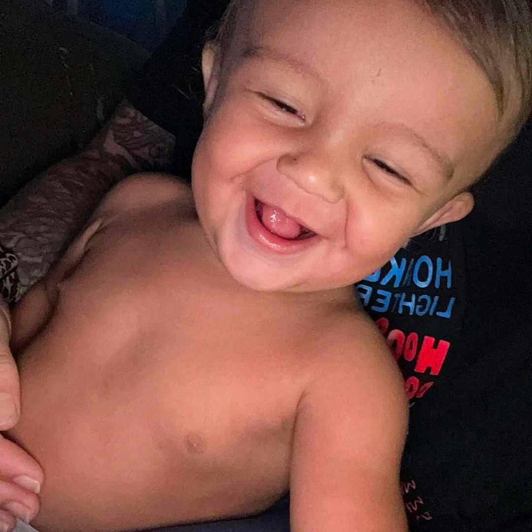 Tydus is registered to the contest to win money with this photo: adult, arm, background, candid, casual, child, closeup, emotion, face, hair, happy, indoors, joy, laughing, person, portrait, skin, smiling, toddler, torso