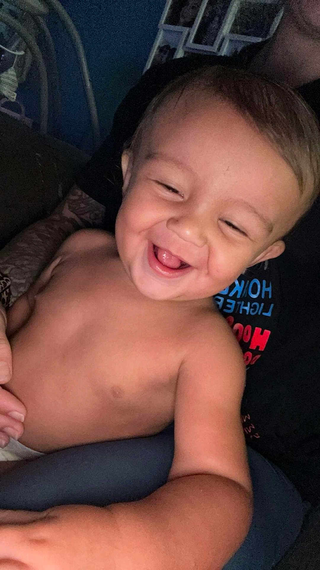 Tydus is registered to the contest to win money with this photo: toddler, child, smiling, happy, laughing, face, skin, arm, torso, person, indoors, adult, background, hair, closeup, joy, emotion, candid, casual, portrait