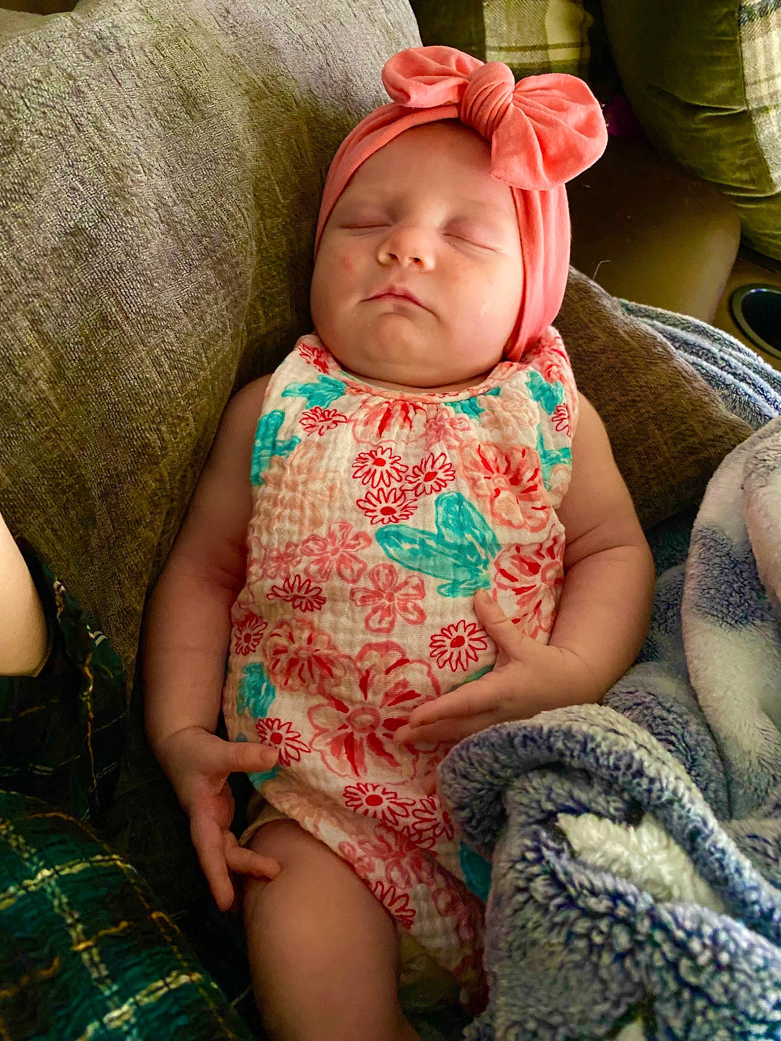 Layken is registered to the contest to win money with this photo: baby, baby_toddler_clothing, cheek, child, comfort, finger, grass, human_body, human_leg, lap, linens, pattern, person, pink, plaid, sitting, skin, sleeve, textile, thigh