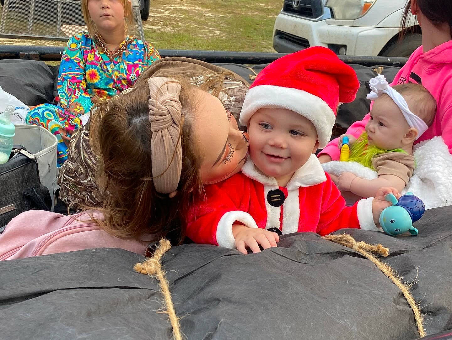 Layton joined the competition — help win amazing prizes! baby, cap, child, event, facial_expression, fun, fur, grass, happy, hat, headwear, joy, leisure, person, recreation, sitting, skin, smile, toddler, tourism