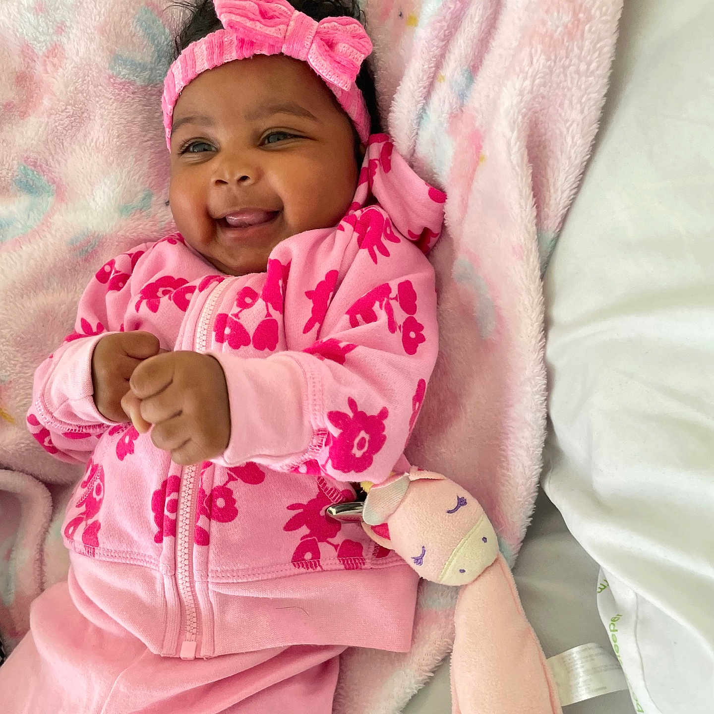 Raniya is registered to the contest to win money with this photo: baby, babylaughing, bed, blanket, clothing, coat, face, furniture, happy, hat, head, jacket, newborn, pajamas, person, photography, portrait, quilt, sleeping, smile