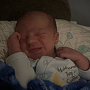 Steven Olivier is registered to the contest to win money with this photo: newborn, baby, infant, blanket, onesie, sleeping, smiling, pillow, bed, cozy, cute, child, resting, soft, indoor, portrait, peaceful, clothing, person, sleep