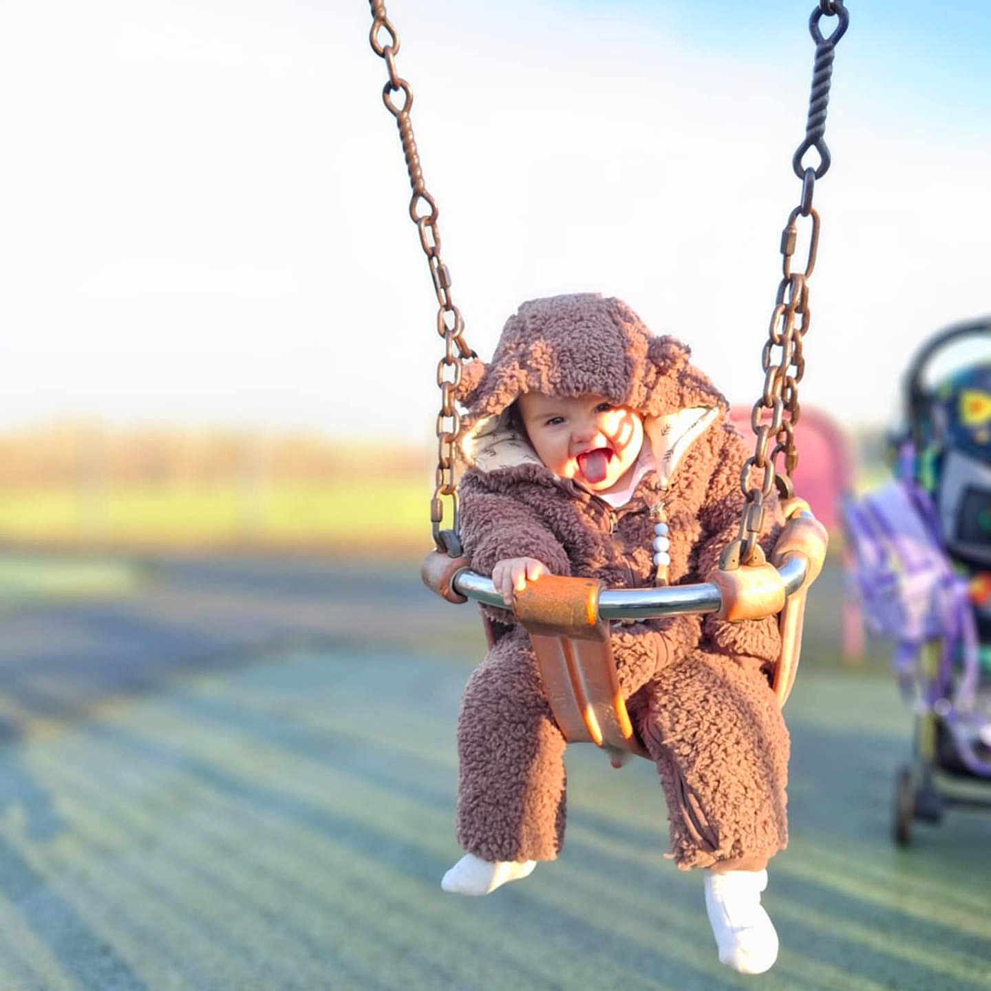 Aster is registered to the contest to win money with this photo: baby, blade, clothing, coat, face, grass, head, hosiery, jacket, nature, outdoorplayarea, outdoors, park, person, photography, plant, playarea, portrait, sock, toy