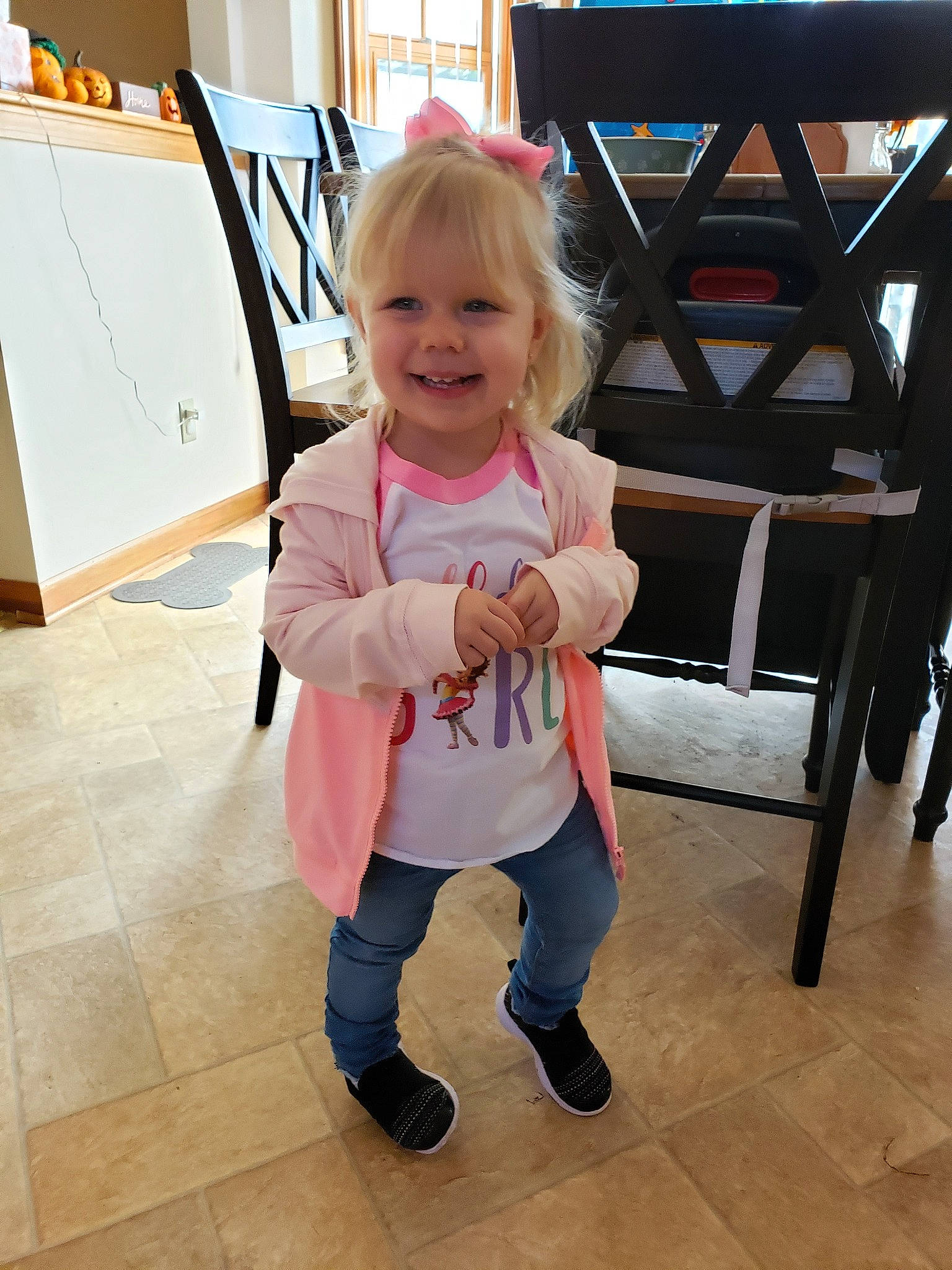 Kyla is registered to the contest to win money with this photo: baby, child, floor, flooring, joy, leg, person, pink, shoe, skin, standing, toddler