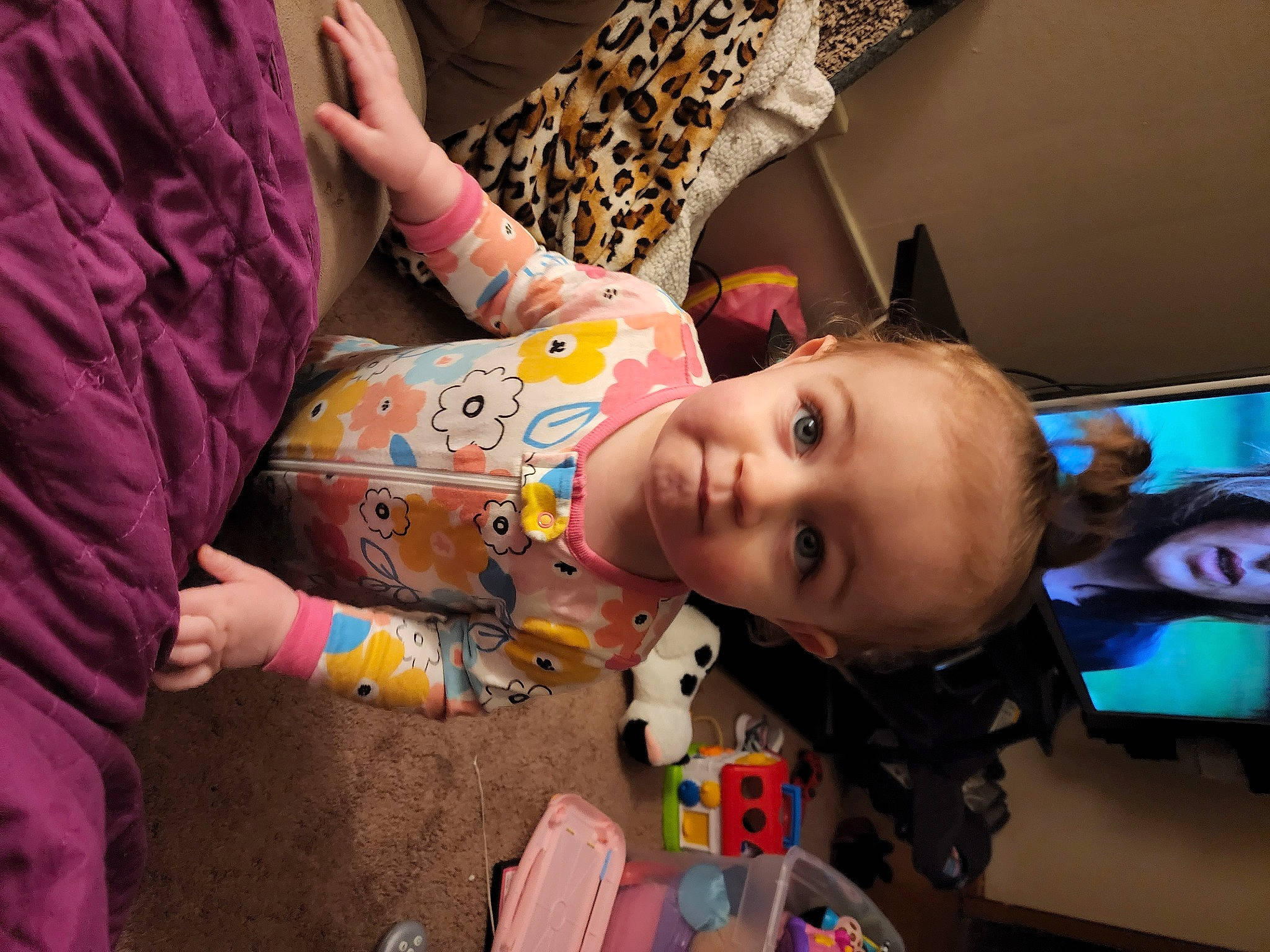 Izabella is registered to the contest to win money with this photo: baby, baby_products, baby_toys, cheek, child, finger, flooring, fun, happy, mouth, nose, pattern, person, play, room, sitting, skin, sleeve, smile, toddler