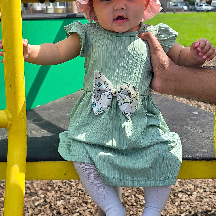 Amairah is registered to the contest to win money with this photo: baby, bonnet, cap, car, clothing, face, grass, hat, head, nature, outdoorplayarea, outdoors, park, person, photography, plant, playarea, portrait, transportation, vehicle