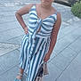 child, girl, striped_dress, handbag, sunglasses, sandals, sidewalk, urban, street, car, tree, summer, fashion, portrait, standing, pose, outdoor, casual, young, confident